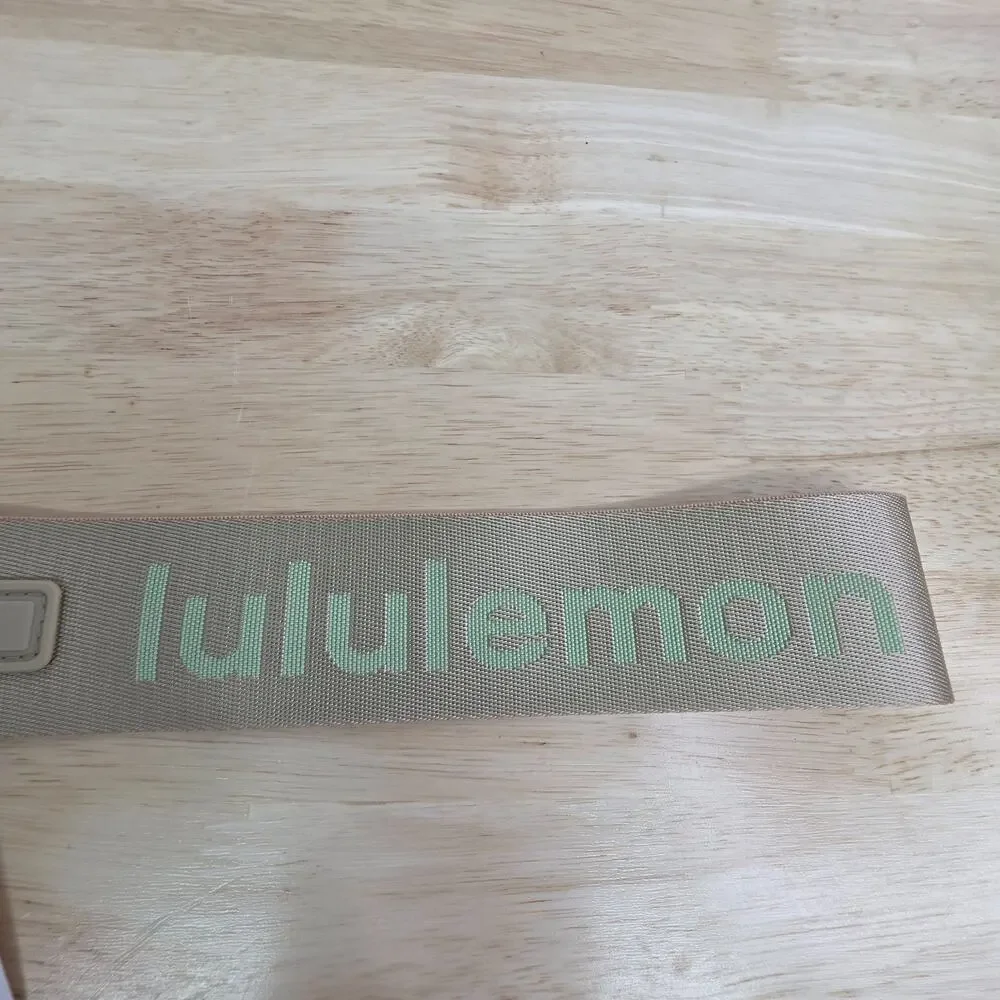 Lululemon Never Lost Keychain Beige & Green Logo Wristlet Strap Carabiner NWT